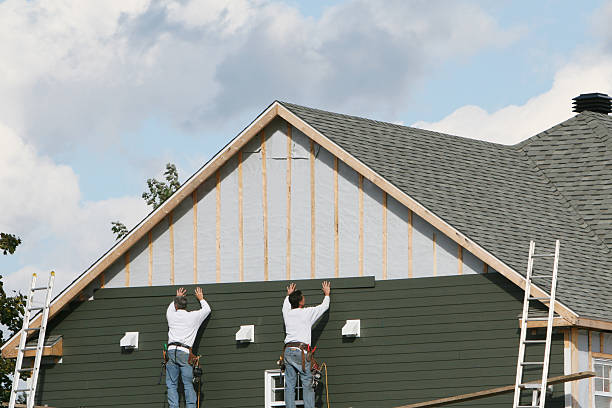 Professional Siding Replacement technician working in East Flat Rock, NC